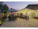 This outdoor space boasts an umbrella table, a covered patio, and comfortable seating for outdoor relaxation and entertainment at 2422 W Acoma Dr, Phoenix, AZ 85023
