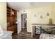 A versatile bedroom with built-in cabinets and hardwood floors offers flexible living and storage options at 2422 W Acoma Dr, Phoenix, AZ 85023