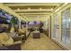 Cozy covered patio with comfortable seating and string lights, creating a warm and inviting outdoor space at 2422 W Acoma Dr, Phoenix, AZ 85023