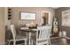 Charming dining area featuring a round table, comfortable seating, and stylish decor at 2422 W Acoma Dr, Phoenix, AZ 85023