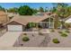 Charming single-Gathering home with desert landscaping and a two-car garage at 2422 W Acoma Dr, Phoenix, AZ 85023