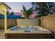 A hot tub offers a tranquil retreat amidst a landscaped yard, perfect for relaxation and enjoying outdoor moments at 2422 W Acoma Dr, Phoenix, AZ 85023