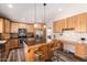 Charming kitchen with custom cabinets, stainless steel appliances, and a breakfast bar with seating at 2422 W Acoma Dr, Phoenix, AZ 85023