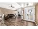 Cozy living room featuring a brick fireplace and wood floors at 2422 W Acoma Dr, Phoenix, AZ 85023