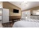 Spacious main bedroom with a beamed ceiling and french doors to the patio at 2422 W Acoma Dr, Phoenix, AZ 85023