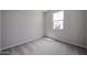A carpeted bedroom has a window and light gray walls at 2586 E Music Mountain Ave, Apache Junction, AZ 85119