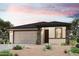 Beautiful single-story home featuring desert landscaping, a two-car garage, and a modern color palette at 2586 E Music Mountain Ave, Apache Junction, AZ 85119
