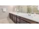 Bathroom with a double sink vanity, tile floors, and neutral walls at 2631 S Sulley Dr # 104, Gilbert, AZ 85295