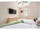 Bedroom with two twin beds, ceiling fan, and neutral walls at 2631 S Sulley Dr # 104, Gilbert, AZ 85295