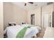 Bedroom with two twin beds, ceiling fan, closet, and neutral walls at 2631 S Sulley Dr # 104, Gilbert, AZ 85295