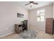 Bedroom with a ceiling fan, neutral walls, and carpeted flooring, creating a relaxing atmosphere at 2631 S Sulley Dr # 104, Gilbert, AZ 85295