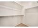 Walk in closet with shelving and neutral carpeting at 2631 S Sulley Dr # 104, Gilbert, AZ 85295