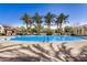 A stunning community pool with mature shade trees, lounge chairs and a gazebo with table seating at 2631 S Sulley Dr # 104, Gilbert, AZ 85295