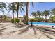 Beautiful community pool with shaded seating and palm trees providing a resort-like atmosphere at 2631 S Sulley Dr # 104, Gilbert, AZ 85295