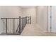 Bright upstairs hallway with neutral walls and carpeted flooring, creating a welcoming transition space at 2631 S Sulley Dr # 104, Gilbert, AZ 85295