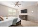 Bedroom with a television, dresser, and a ceiling fan at 2631 S Sulley Dr # 104, Gilbert, AZ 85295