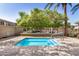 Inviting small outdoor pool surrounded by mature trees, offering a refreshing and tranquil retreat at 2631 S Sulley Dr # 104, Gilbert, AZ 85295