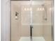 Shower with tiled walls, a glass door, and a shower head at 2631 S Sulley Dr # 104, Gilbert, AZ 85295