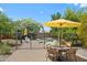 Backyard patio with pool, lounge chairs, dining table, and lush foliage at 28814 N 45Th St, Cave Creek, AZ 85331