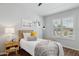 Bright bedroom with wood floors, large window, and stylish decor at 28814 N 45Th St, Cave Creek, AZ 85331
