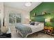 Stylish bedroom with large window, modern lighting, and unique accent wall at 28814 N 45Th St, Cave Creek, AZ 85331