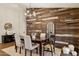Elegant dining room with rustic wood accent wall, chandelier, and seating for six at 28814 N 45Th St, Cave Creek, AZ 85331