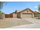 Beige exterior with desert landscaping and a two car garage and fenced in side yard at 28814 N 45Th St, Cave Creek, AZ 85331