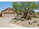 Charming single-story home featuring a well-maintained front yard, desert landscaping and a two-car garage at 28814 N 45Th St, Cave Creek, AZ 85331
