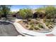 Landscaped front yard with desert plants, trees, rocks, and a winding sidewalk at 28814 N 45Th St, Cave Creek, AZ 85331