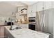 A gourmet kitchen features an island, stone countertops, and stainless steel appliances at 28814 N 45Th St, Cave Creek, AZ 85331