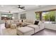 Living room features an oversized sectional and lots of light through a big window at 28814 N 45Th St, Cave Creek, AZ 85331