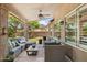 Covered patio area with ceiling fan and wicker furniture provides an oasis for relaxing and entertaining at 28814 N 45Th St, Cave Creek, AZ 85331