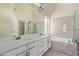 This spacious bathroom features a soaking tub, shower, and dual sink vanity at 3109 N Meadow Dr, Avondale, AZ 85392