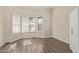 This bright bedroom has plantation shutters and wood-look flooring at 3109 N Meadow Dr, Avondale, AZ 85392