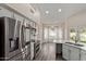 This modern kitchen features stainless steel appliances and an island with sink at 3109 N Meadow Dr, Avondale, AZ 85392