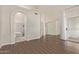 This spacious living room has wood-look flooring, an archway, and a sliding glass door at 3109 N Meadow Dr, Avondale, AZ 85392
