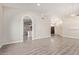 Spacious living room with gray wood floors and open floor plan at 3109 N Meadow Dr, Avondale, AZ 85392