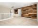Spacious bonus room with unique wood paneling, a wet bar, and plenty of natural light at 3247 E Creosote Ln, Gilbert, AZ 85298