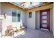 Welcoming front porch with chairs and a brick-paved patio, perfect for enjoying the neighborhood views at 3247 E Creosote Ln, Gilbert, AZ 85298