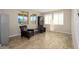 Cozy sitting area with two leather chairs, a bookshelf, and bright windows at 3247 E Creosote Ln, Gilbert, AZ 85298