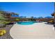 Stunning pool in a landscaped backyard with desert plants and a stone patio, offering a relaxing oasis at 3247 E Creosote Ln, Gilbert, AZ 85298