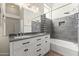 Stylish bathroom with double sinks, a large mirror, modern lighting, and a shower-tub combination at 351 N Danyell Dr, Chandler, AZ 85225