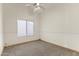 Bedroom with neutral carpet, window, and minimal design elements at 351 N Danyell Dr, Chandler, AZ 85225