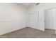 Bedroom with neutral carpet, sliding door closet, and white trim at 351 N Danyell Dr, Chandler, AZ 85225