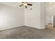Spacious bedroom with neutral carpet and modern ceiling fan fixture at 351 N Danyell Dr, Chandler, AZ 85225