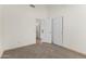 Bedroom with neutral carpet, sliding door closet, and white trim at 351 N Danyell Dr, Chandler, AZ 85225