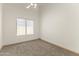 Bright bedroom with a window, neutral carpet, and minimal design elements at 351 N Danyell Dr, Chandler, AZ 85225
