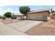 Suburban house featuring a two-car garage, mature landscaping and a driveway at 351 N Danyell Dr, Chandler, AZ 85225