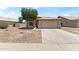 Attractive home featuring a well-maintained yard, a two-car garage, and a welcoming curb appeal at 351 N Danyell Dr, Chandler, AZ 85225