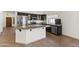 Well-equipped kitchen with stainless steel appliances, granite countertops, and a breakfast bar island at 351 N Danyell Dr, Chandler, AZ 85225